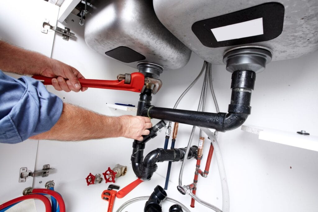 Lehigh Acres Plumbing Pros fixing under sink plumbing and drain pipes