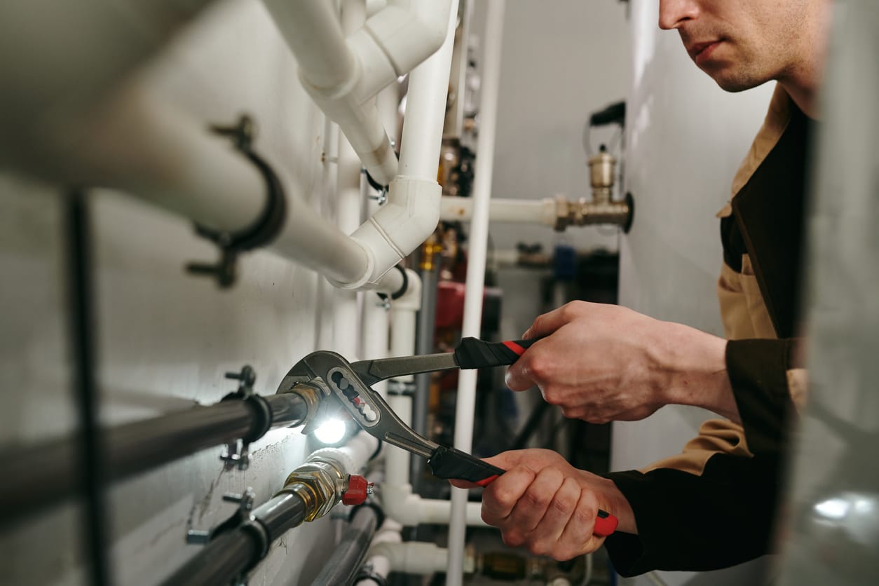 Plumbers maintaining commercial plumbing pipes in Lehigh Acres